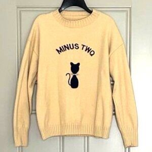 Sweater Pullover Neck. Fuzzy. With applique.